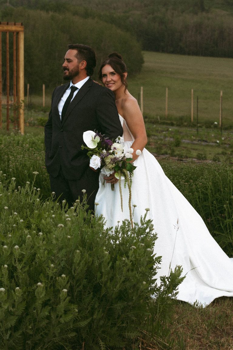 Morgan and Tim’s June wedding at Aurora Valley in Taylor, British Columbia, was the kind of day that stays with you long after it’s over. Set against the dramatic landscapes of northern BC, their celebration had a moody, romantic edge; intimate and deeply personal, with a quiet intensity that made every frame feel significant.
